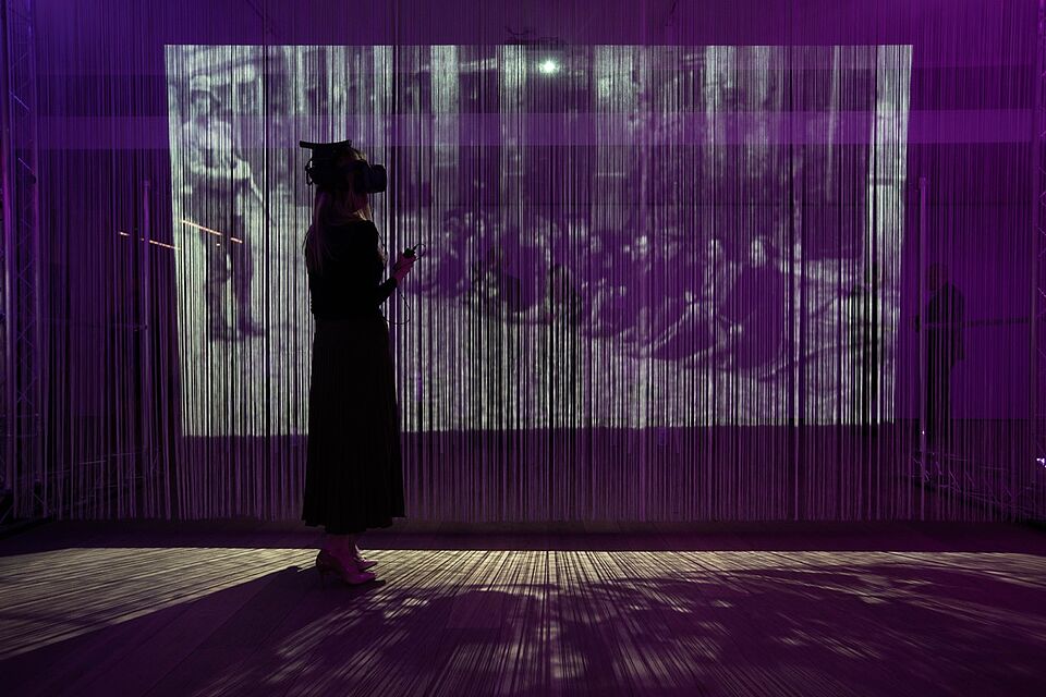 A user engages with the Eye as Witness exhibit created by the National Holocaust Museum (UK). Copyright NHM